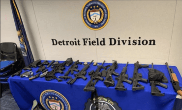 Melvindale man pleads guilty after police recover 18 weapons, fake fed IDs from home